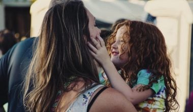 daughter trying to make mom smile