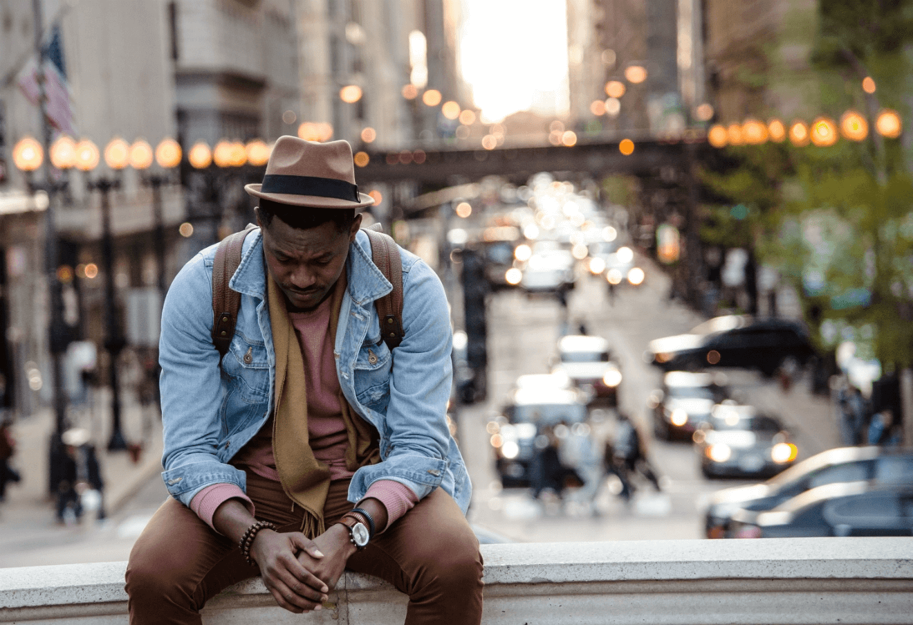 black man depressed sitting